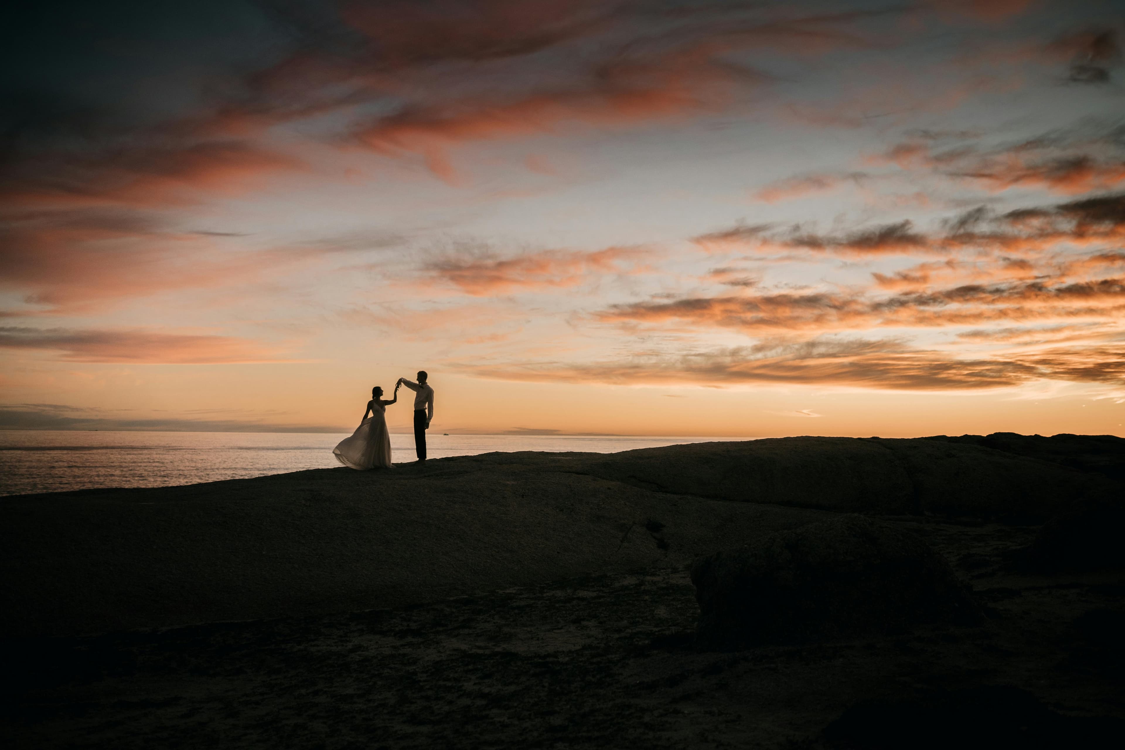 Couple silhouetted at sunset for a Cyprus elopement
