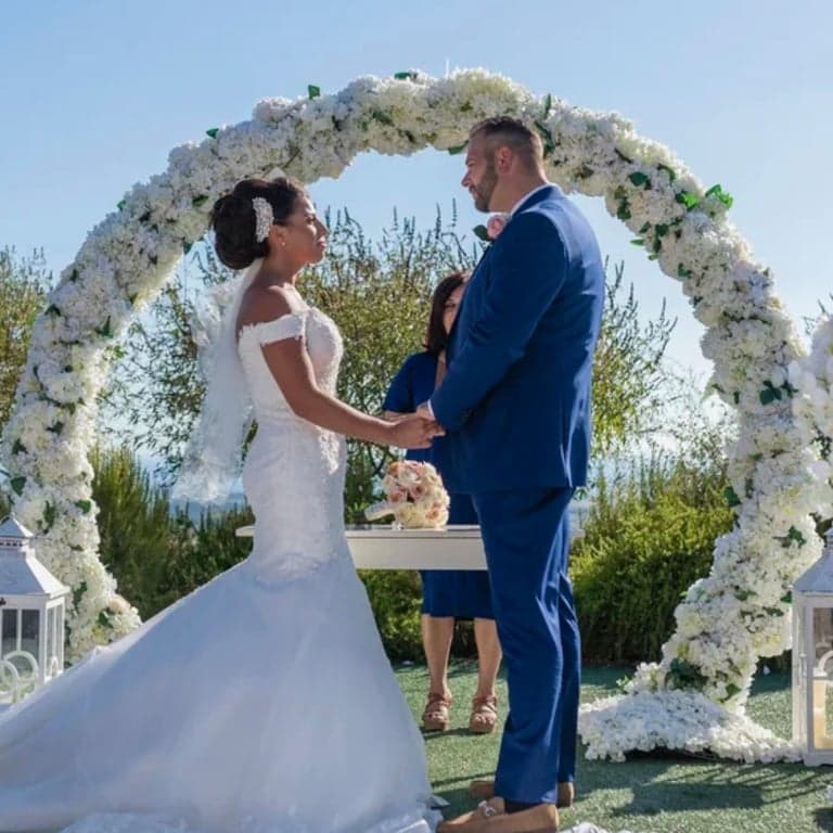 Vows under ceremony arch at Elea Estate, Cyprus destination wedding