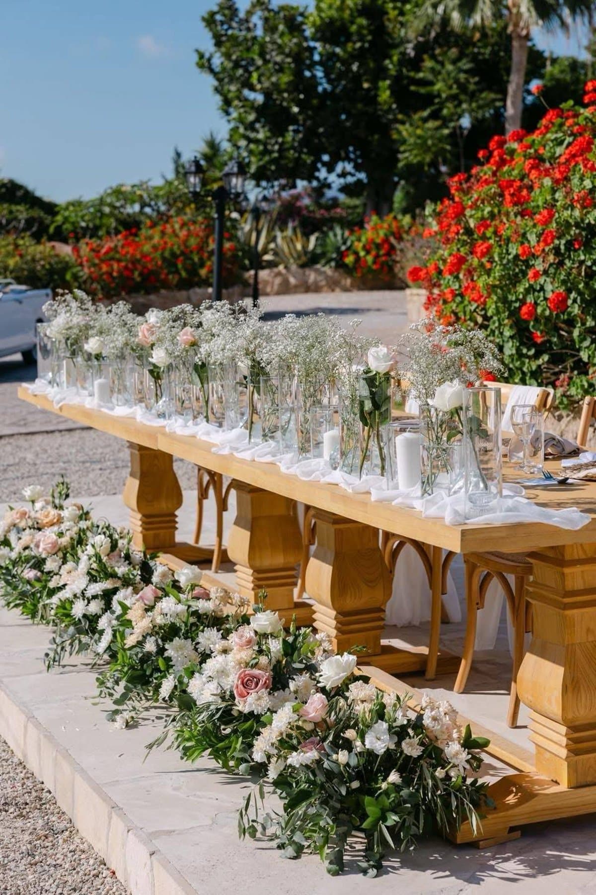 L'Chateau head table with tall floral centrepieces