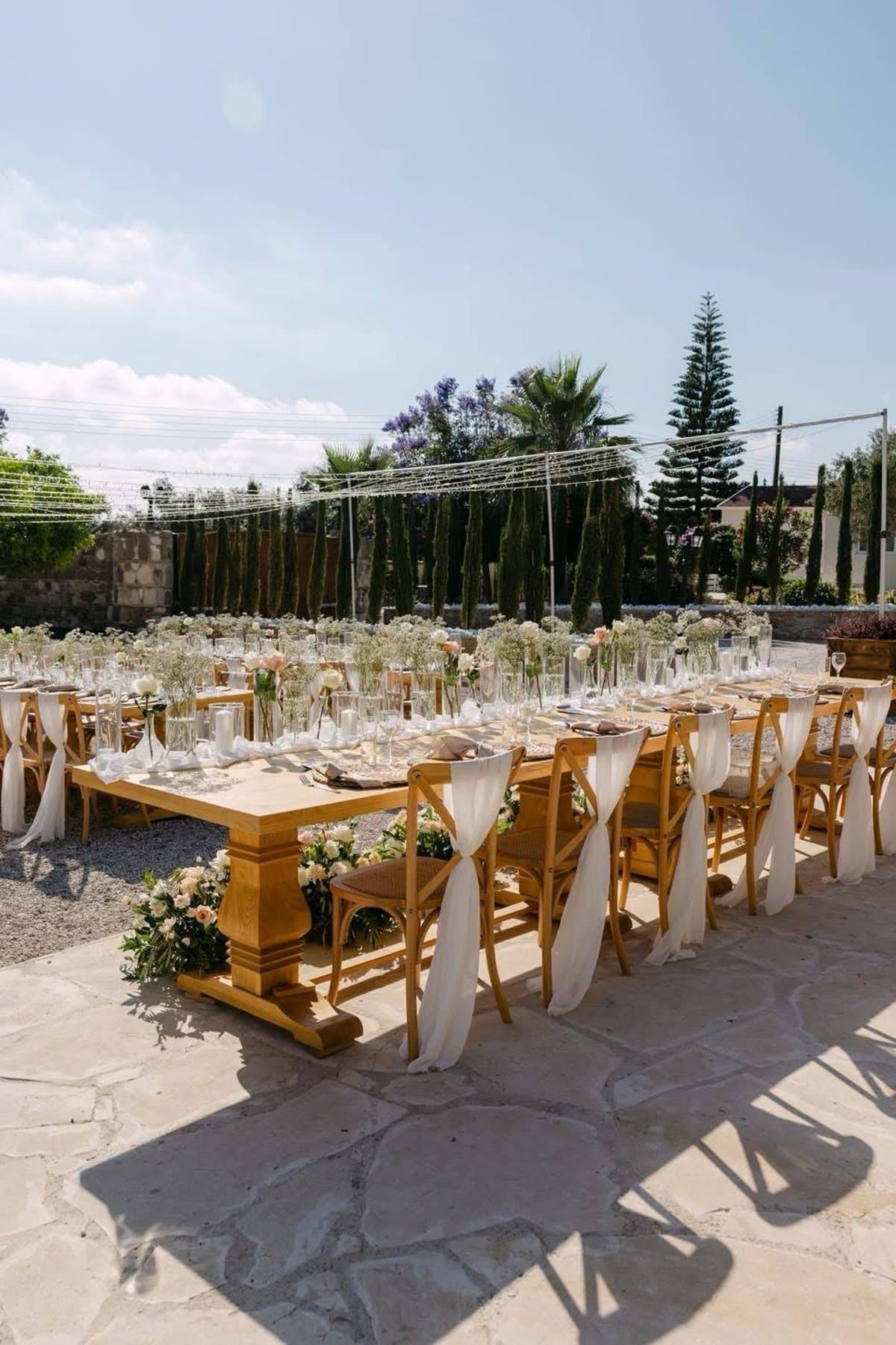 Long-table floral reception at L'Chateau, Cyprus